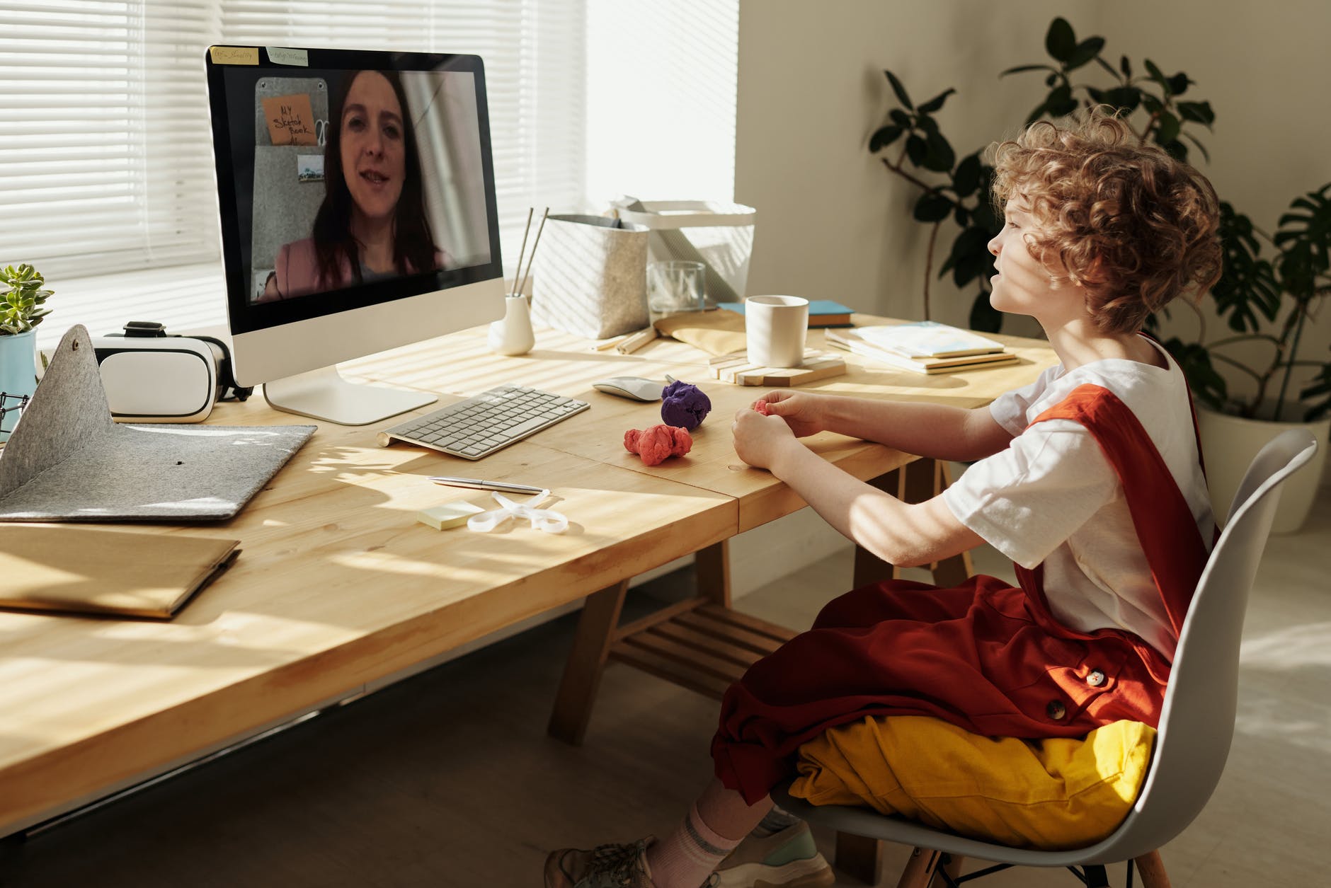 photo of child watching through imac